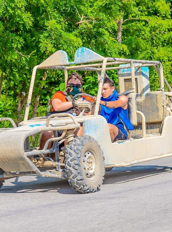 Tour group enjoying a refreshing cenote during the buggy adventure