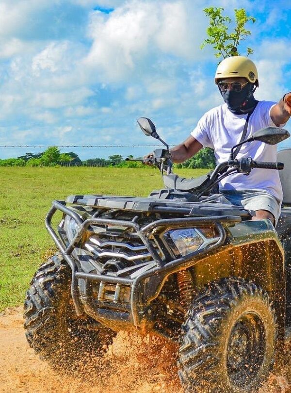 ATV riders driving towards Punta Cana beach with ocean views